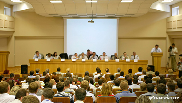 A room full of people attending a meeting.