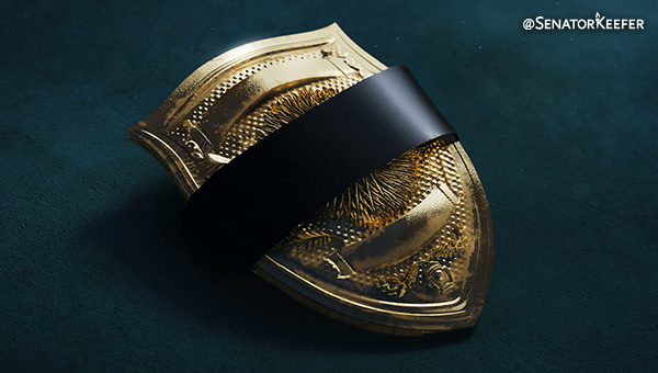 Police badge with black tape over the center of it.