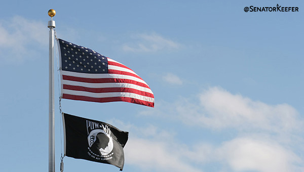 A pole with the American and POW/MIA flags on it.