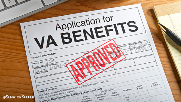 Picture of VA benefits application with the word approved stamped on it.