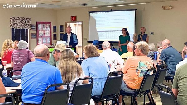 A room full of people listening to Senator Dawn Keefer speak at a School Property Tax Elimination Town Hall.