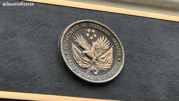 U.S. Department of Veterans Affairs seal on building.