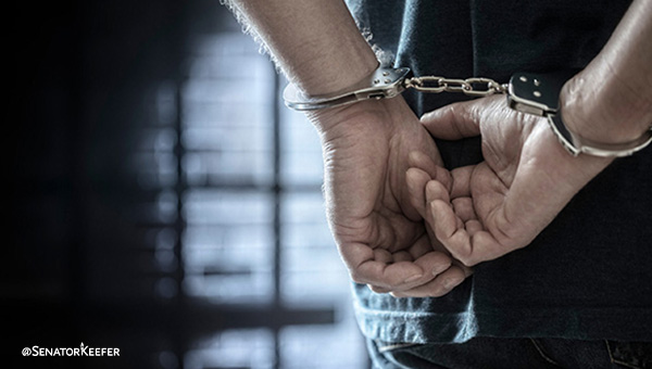 Picture of hands in handcuffs.